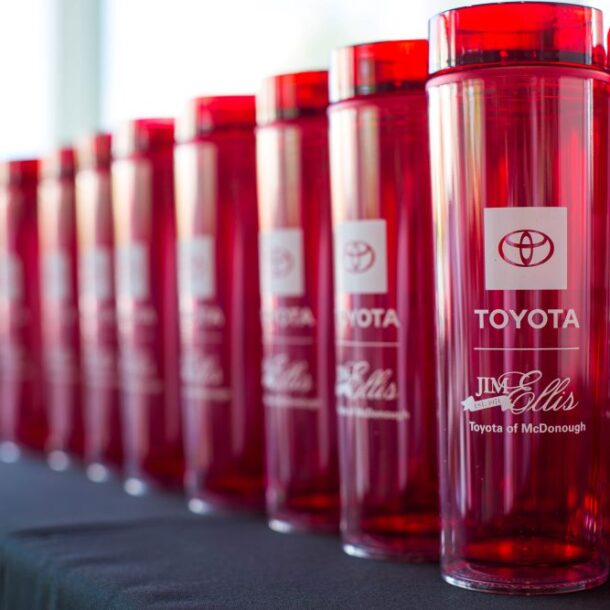 branded cups lined up on a table