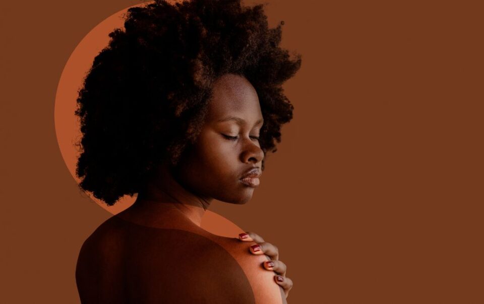 Black woman with natural hair posing with eyes closed